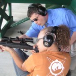 Girl shooting, Camp Compass Academy