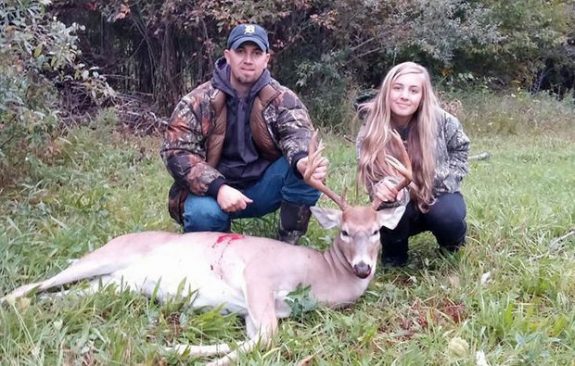 Brian Ellison of Rockford Michigan with his daughter, 15, and 10-point buck.
