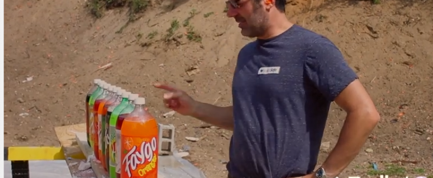 Watch the comparison of a bullet proof vest and 10 bottles of soda.
